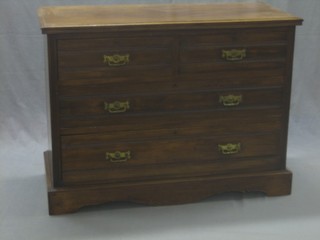 An Edwardian walnut chest of 2 short and 2 long drawers, raised on a platform base 42"
