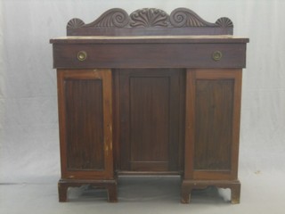 A William IV mahogany inverted breakfront sideboard with raised carved back, the base fitted a drawer above a triple cupboard, raised on bracket feet 42"