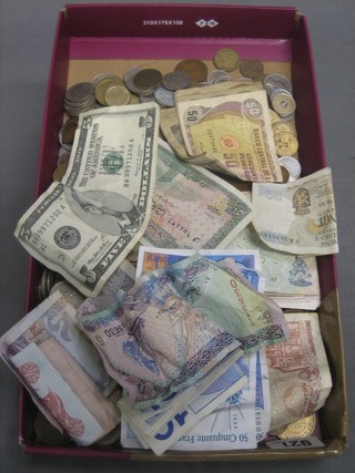 A collection of various world coins and other bank notes