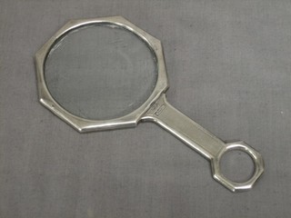 A silver octagonal magnifying glass, Birmingham 1913 by Mappin & Webb, marks rubbed