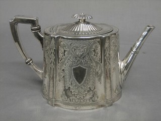 An oval engraved Britannia metal teapot
