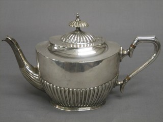 A Victorian silver plated teapot with demi-reeded decoration