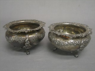 A pair of embossed silver plated jardinieres with pierced borders, raised on 3 scrolled supports
