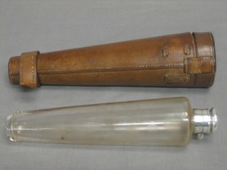 A glass hunting flask with silver plated mounts contained in a leather carrying case