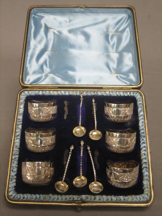 6 Victorian embossed silver salts together with 5 spoons, Birmingham 1883, 7 ozs