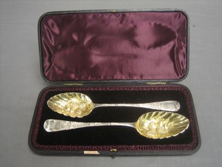 A pair of William III silver Old English pattern berry spoons with silver gilt bowls by William Bateman, London 1810 4 ozs, cased