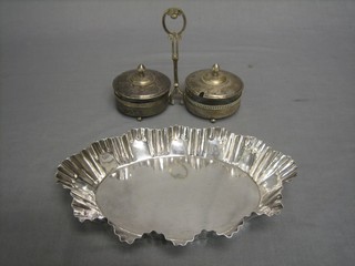 A Continental silver plated and glass cylindrical twin division preserve jar together with an oval shaped dish 10"