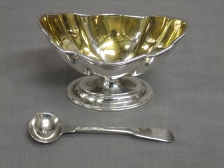A George III silver boat shaped salt on an oval spreading foot, London 1806 together with a Georgian silver fiddle pattern mustard spoon, 3 ozs