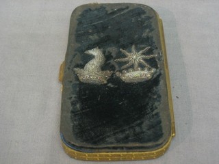A 19th Century rectangular embroidered spectacle case with armorial decoration