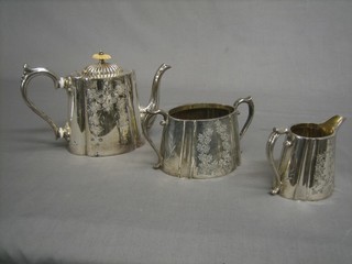 A Victorian engraved Britannia metal 3 piece tea service comprising and oval engraved teapot, twin handled sugar bowl and cream jug