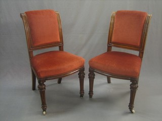 A set of 4 Victorian bleached oak show frame dining chairs upholstered in burnt orange and raised on turned fluted supports
