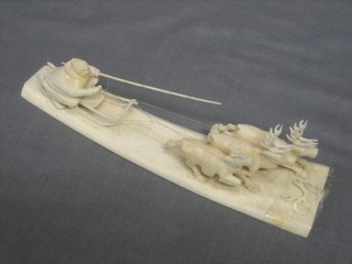 A carved ivory figure group of a sleigh 8"
