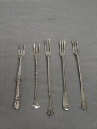 3 silver pickle forks and 2 others