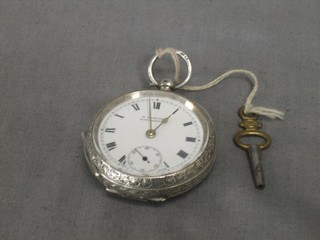 An open faced fob watch by H Samual with enamelled dial and Roman numerals contained in a silver case