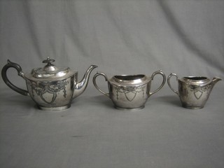 A Britannia metal 3 piece tea service comprising teapot, twin handled sugar bowl and cream jug