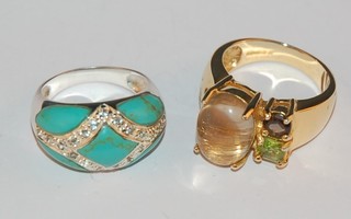 A silver dress ring set an oval amber coloured stone and 2 other coloured stones, and a silver dress ring set turquoise