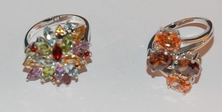 2 silver dress rings set coloured stones