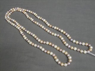 A rope of pink, lilac, peach and white fresh water pearls