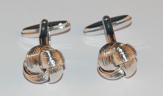 A pair of modern silver knot cufflinks