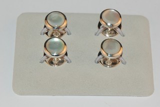 A set of 4 modern silver and mother of pearl dress studs