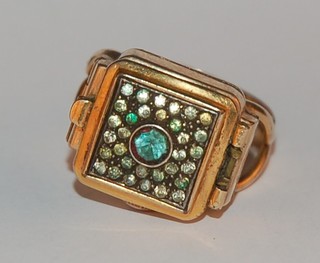 A watch ring by Flica contained in a gold plated case
