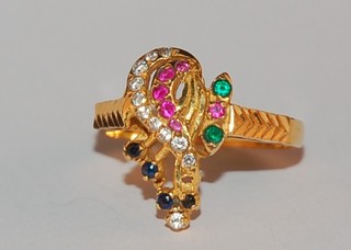 An 18ct Eastern gold dress ring set semi-precious stones