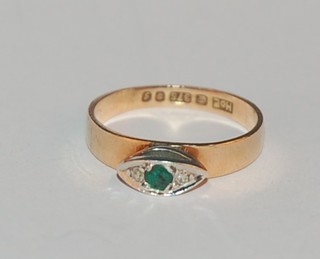 A 9ct gold dress ring set an emerald and 2 diamonds