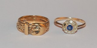 A 9ct gold buckle ring and a 9ct gold ring set blue and white stones