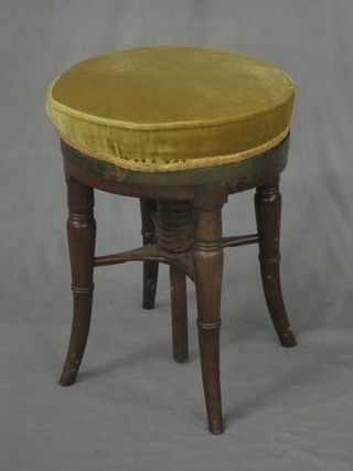 A circular William IV mahogany revolving piano stool