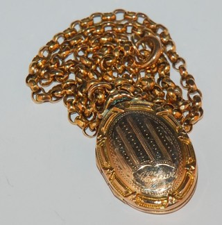 A gold belcher link chain hung a gilt metal locket