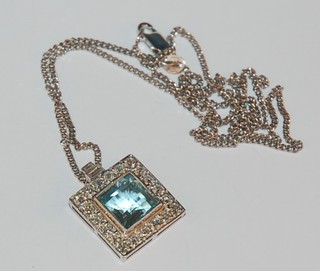 A lady's very attractive 18ct white gold square pendant set an aquamarine and diamonds, hung on a platinum chain