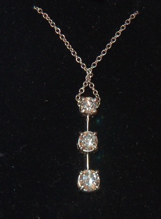 A lady's 18ct white gold pendant set 3 diamonds, approx 0.60ct