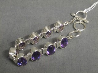 A silver bracelet set 9 oval cut amethysts