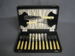 An Art Deco set of 6 silver plated fish knives and forks complete with servers, cased