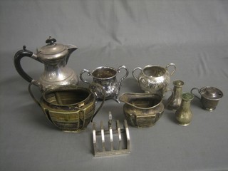 A 3 piece silver plated condiment set comprising mustard and 2 peppers, a silver plated 5 bar toast rack, a hotwater jug and other plated items