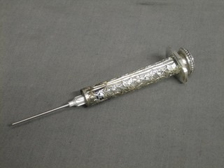 A silver plated syringe for use with flowers