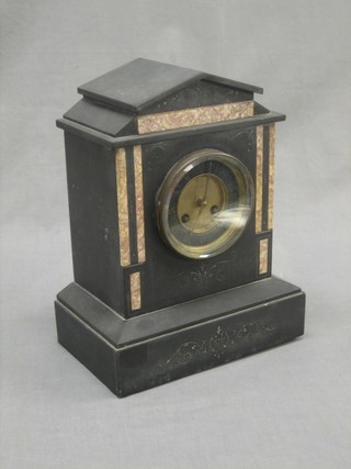 A Victorian striking mantel clock with Roman Numerals contained in a 2 colour marble architectural case