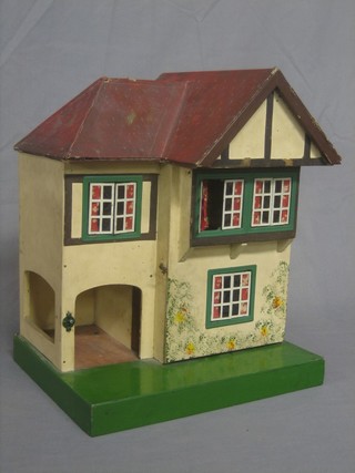 A 1930's wooden dolls house 15"