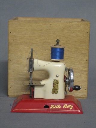 A childs Little Betty sewing machine, contained in a wooden box