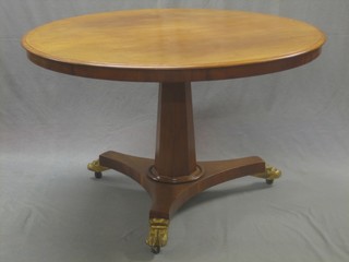 A Victorian bleached mahogany  circular Loo table, raised on a chamfered column with tripod base 47"