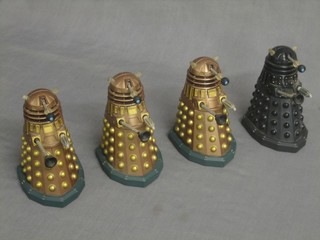 4 plastic Dalek figures, bases marked PCPT 575 7 186, 4 1/2"