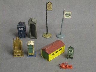 2 bus stops, a pressed metal RAC box (43A), a metal Police box 751, a Matchbox garage, a green painted Hornby platform vending machine, a Britains metal model sentry box and a metal model of the Coronation chair 