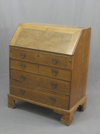 A 19th Century bleached oak bureau the fall front revealing a well fitted interior above 4 long graduated drawers with brass swan neck handles, raised on bracket feet 30"