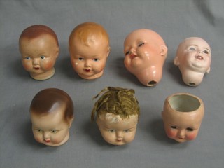 A biscuit porcelain dolls head marked S.F.B.J 236 Paris (f), 1 other marked Dollie  British and 2 other porcelain dolls heads