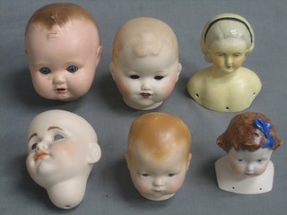 A Heubach Koppelsdorf biscuit porcelain dolls head, an Armand Marseille biscuit porcelain dolls head marked AM Germany 514/2 and 1 other Armand Marseille dolls head