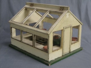 A childs wooden model green house with glazed panels, various terracotta saucers, pressed metal watering can and pail, 17"