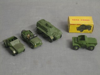 A Dinky Scout car no.673 boxed, 1 other unboxed, a Dinky Champ Jeep no.674 and a Dinky armoured Personnel Carrier