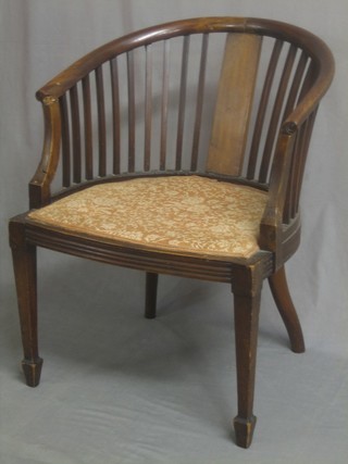 An Edwardian mahogany tub back chair (f and r)