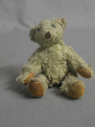 A yellow bear with articulated limbs 5"