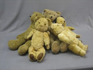 5 various yellow teddybears contained in a plastic crate